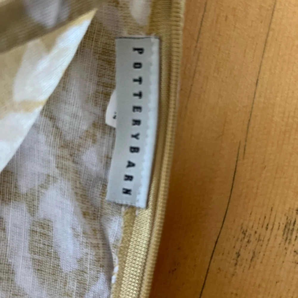 Pottery Barn pillow shame 23” wide  Light gold and white w/ zipper.